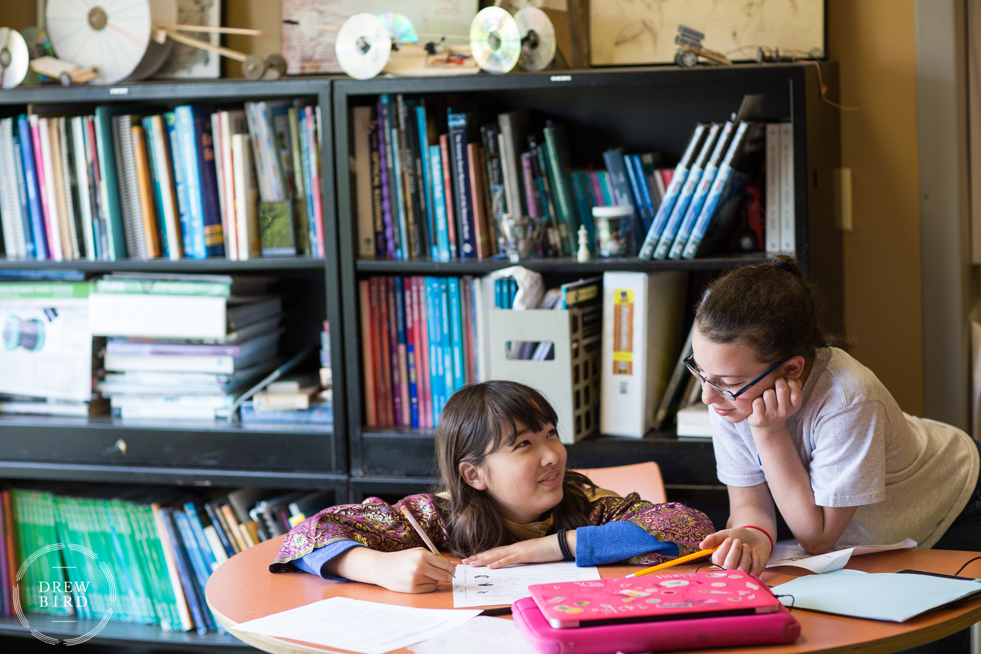 Two grade school students working together in the classroom at Poughkeepsie Day School in New York. San Francisco independent school photographer and private school education lifestyle photography by Drew Bird.